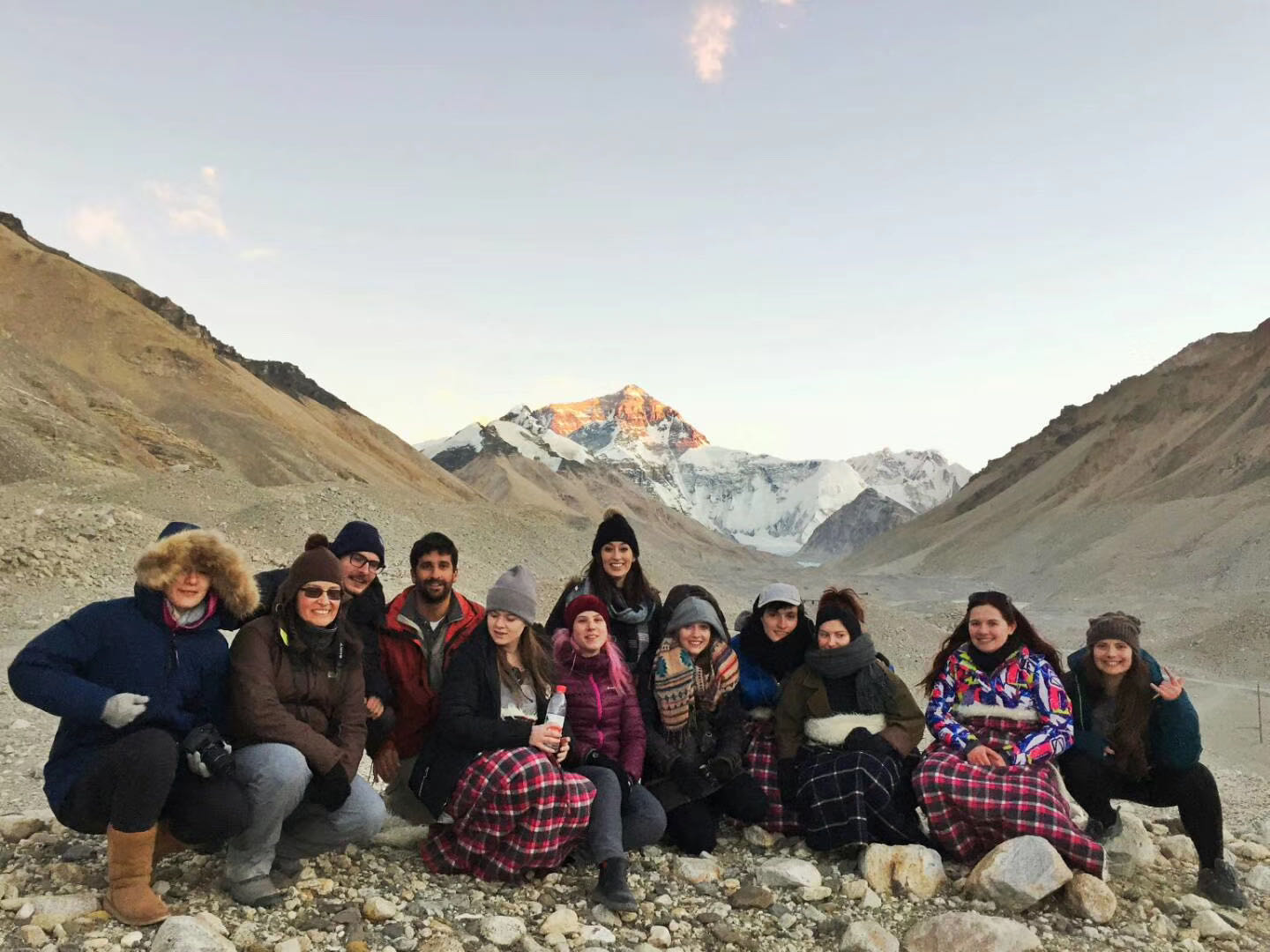 Traveler group resting together in a rocky mountain valley