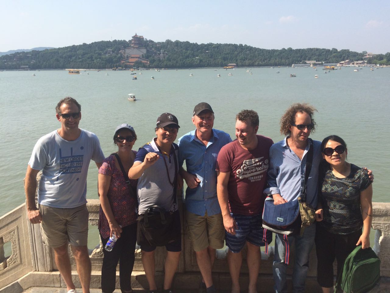 Travelers posing beside Kunming Lake at the Summer Palace